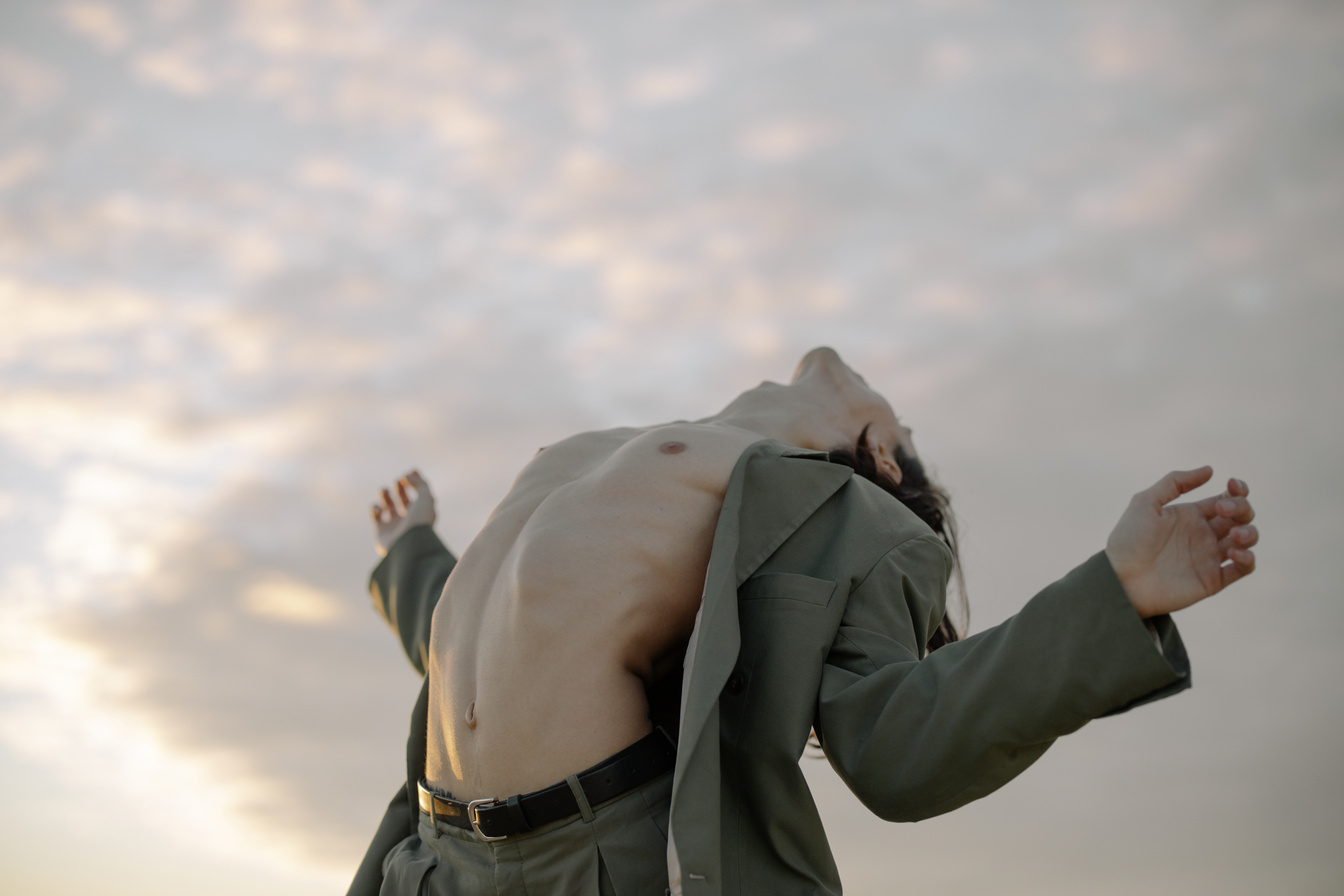 Man in Gray Jacket and Gray Pants